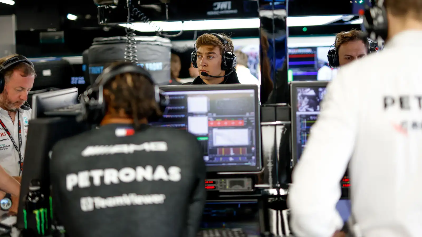 George Russell and Lewis Hamilton opposite one another in the Mercedes garage. Spain June 2023