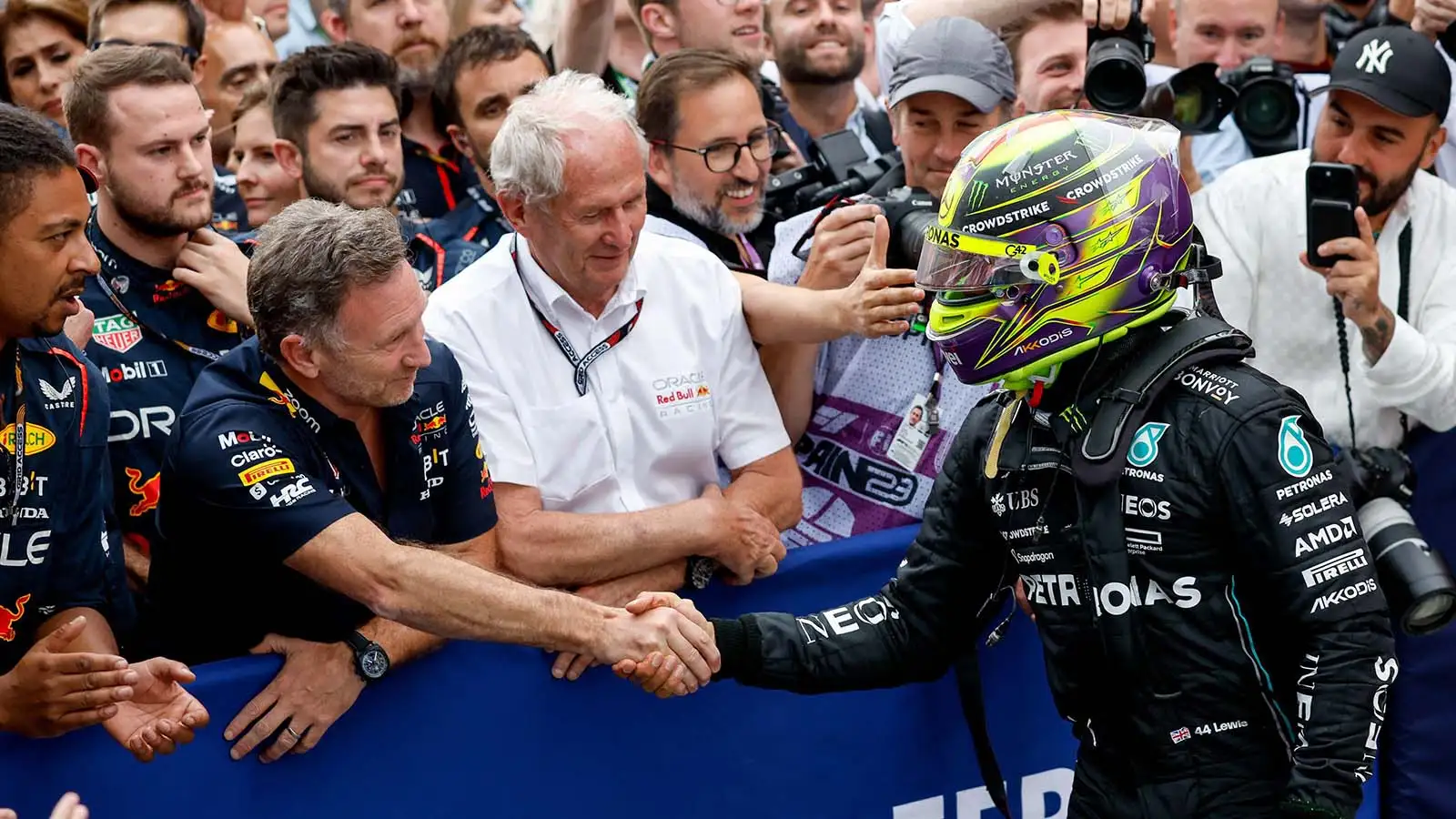 Mercedes driver Lewis Hamilton shakes hands with Red Bull's Christian Horner. Spain June 2023