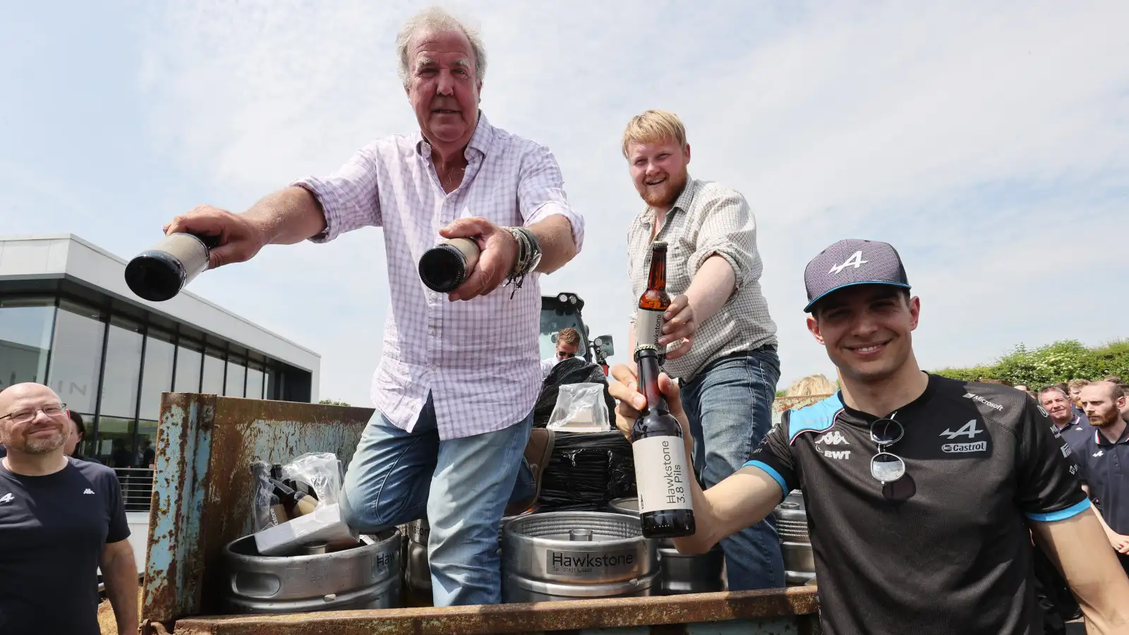 Alpine driver Esteban Ocon joins Jeremy Clarkson and Kaleb Cooper to help hand out Hawkstone beers at Enstone.