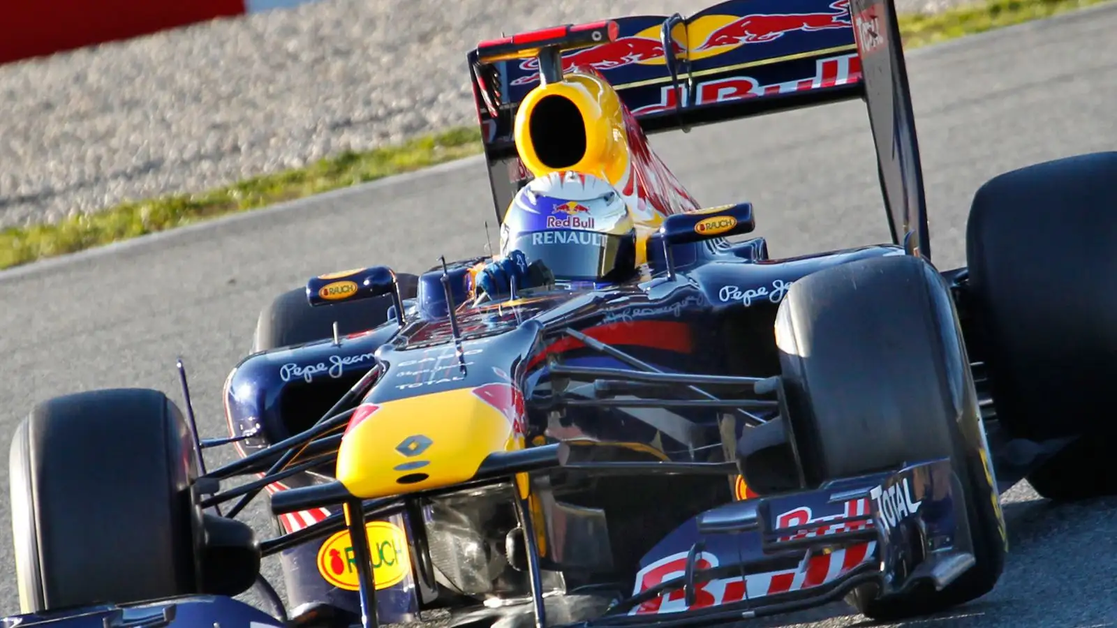 Sebastian Vettel drives the title-winning Red Bull RB7 car in F1 pre-season testing in Spain. Barcelona, 2011.