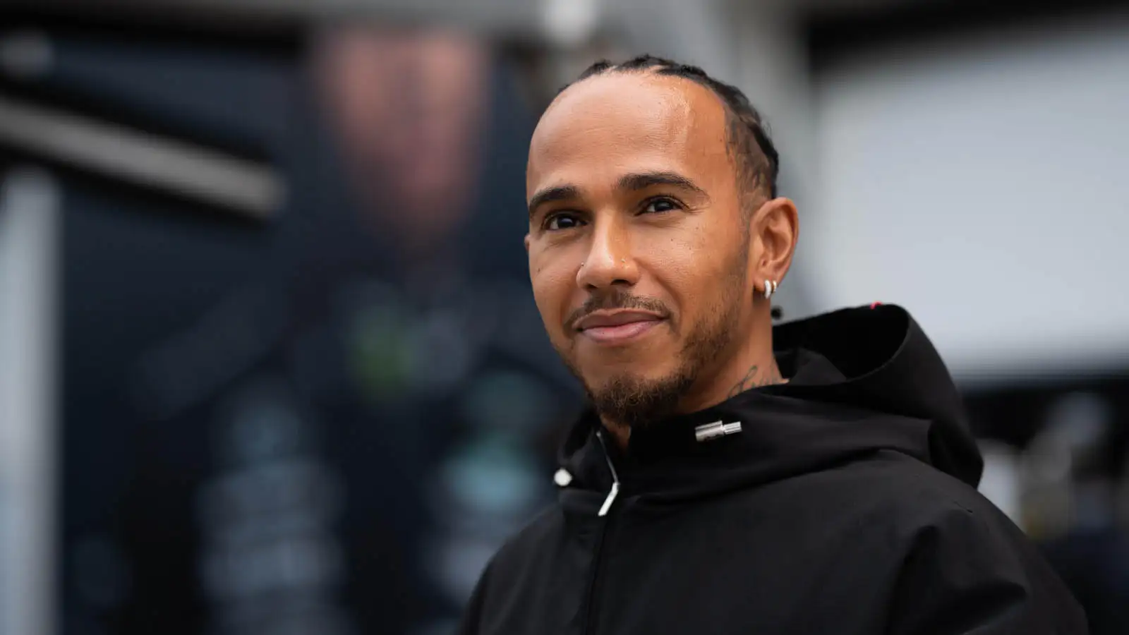 Lewis Hamilton smiles at fans when he arrives at the Circuit Gilles Villeneuve.