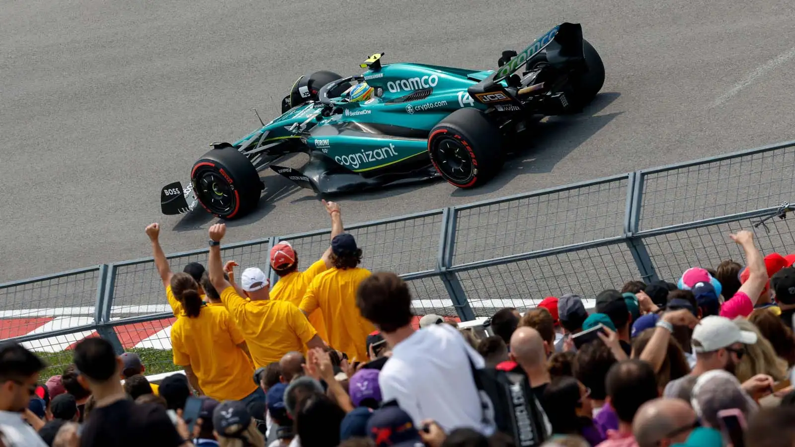 Fernando Alonso drives past fans. Montreal June 2023.
