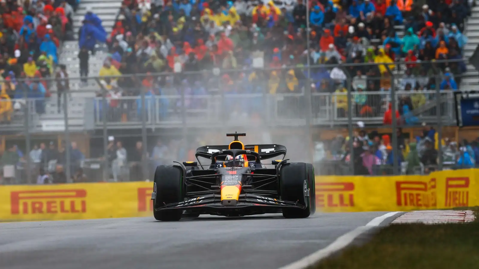 Spray kicks up behind Max Verstappen's car. Montreal, Canada. June 2023.