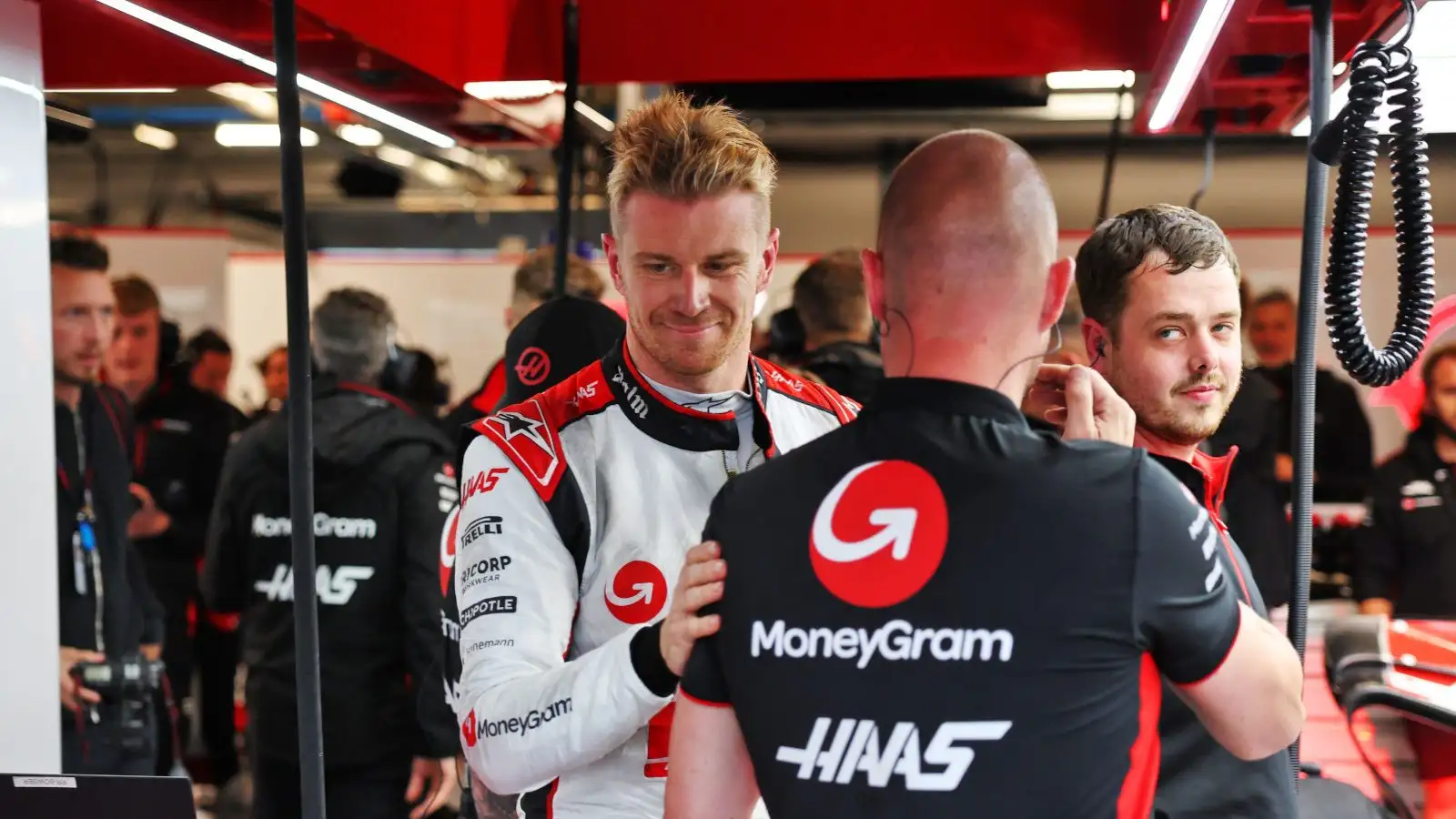 Nico Hulkenberg with his mechanics in the Haas garage. Canada June 2023