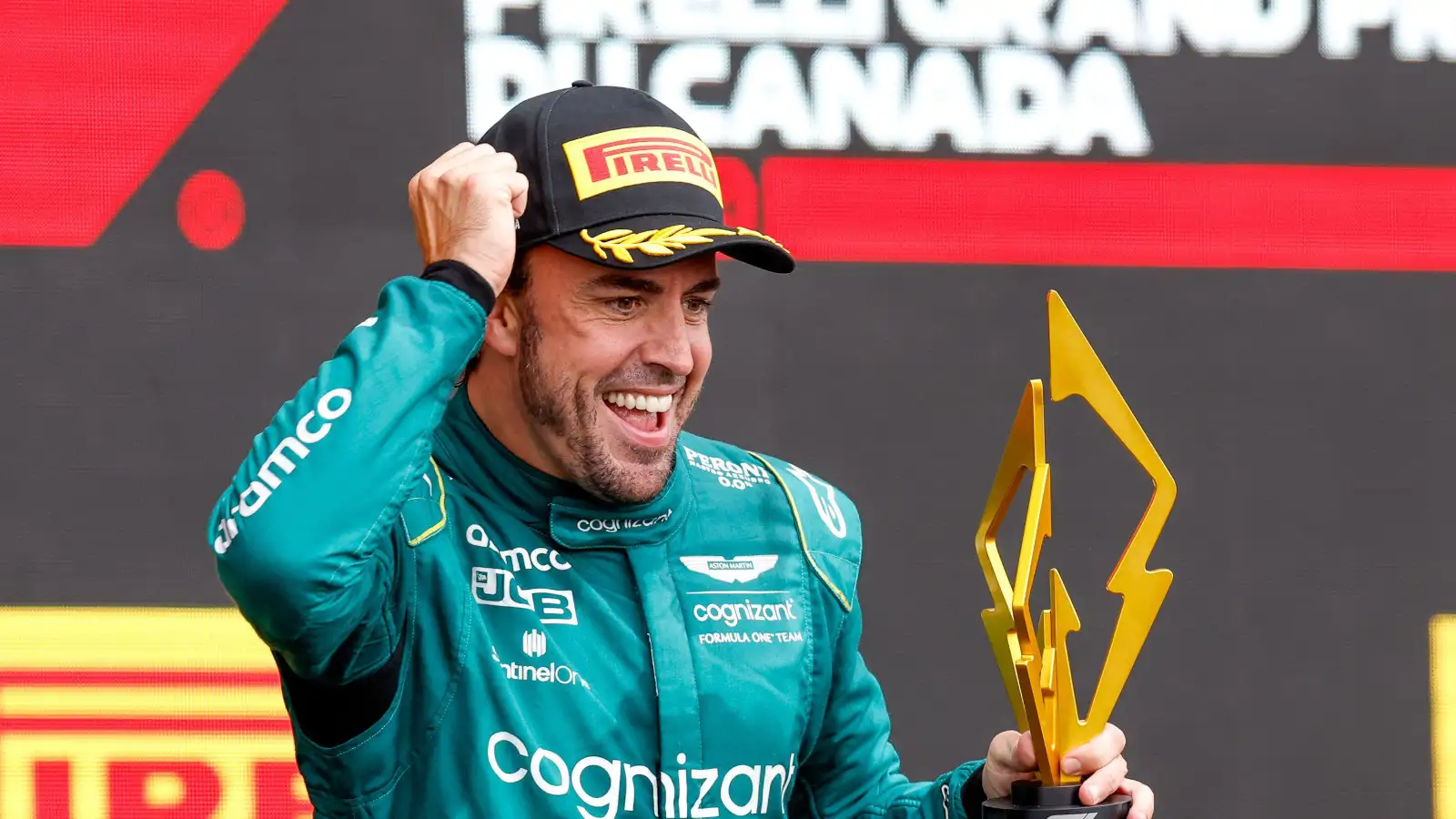 Fernando Alonso smiling on the podium with the P2 trophy. Canada June 2023