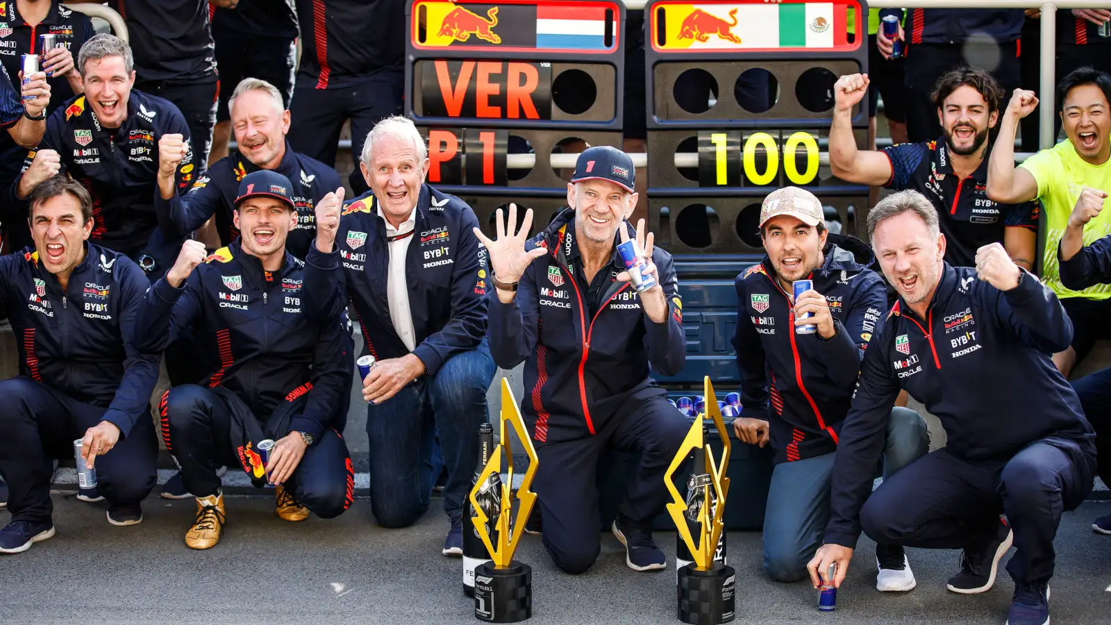 Red Bull celebrate their 100th grand prix win, Max Verstappen P1, with Helmut Marko and Sergio Perez either side. Canada June 2023