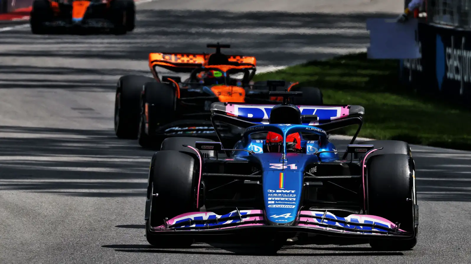 Esteban Ocon lapping ahead of Lando Norris. Canada June 2023