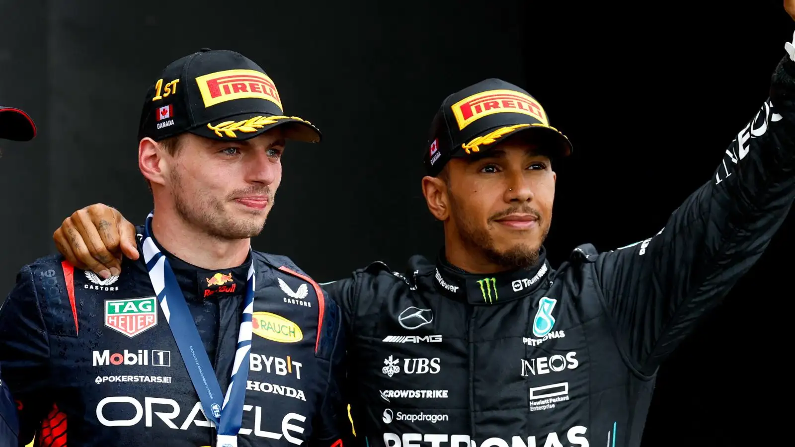 Max Verstappen (Red Bull) and Lewis Hamilton (Mercedes) celebrate on the podium at the Canadian Grand Prix. Montreal, 2023.
