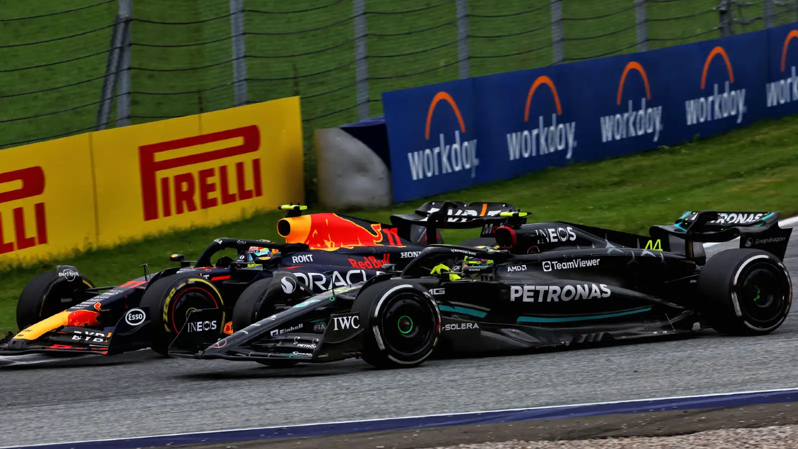 Red Bul driver Sergio Perez battles with Mercedes' Lewis Hamilton at the Austrian Grand Prix. Spielberg, July 2023. Track limits
