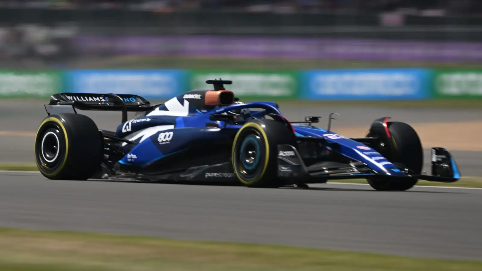 Alex Albon drives special-liveried Williams FW45. Silverstone, July 2023.