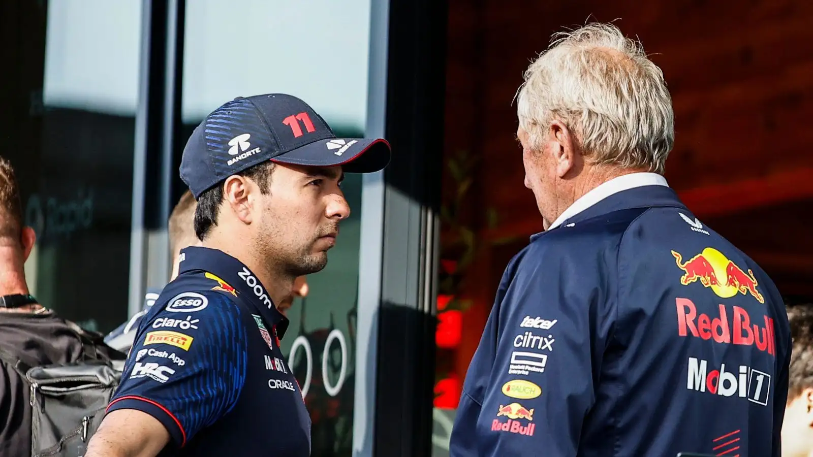 塞吉奥Perez in serious conversation with Helmut Marko. Britain July 2023