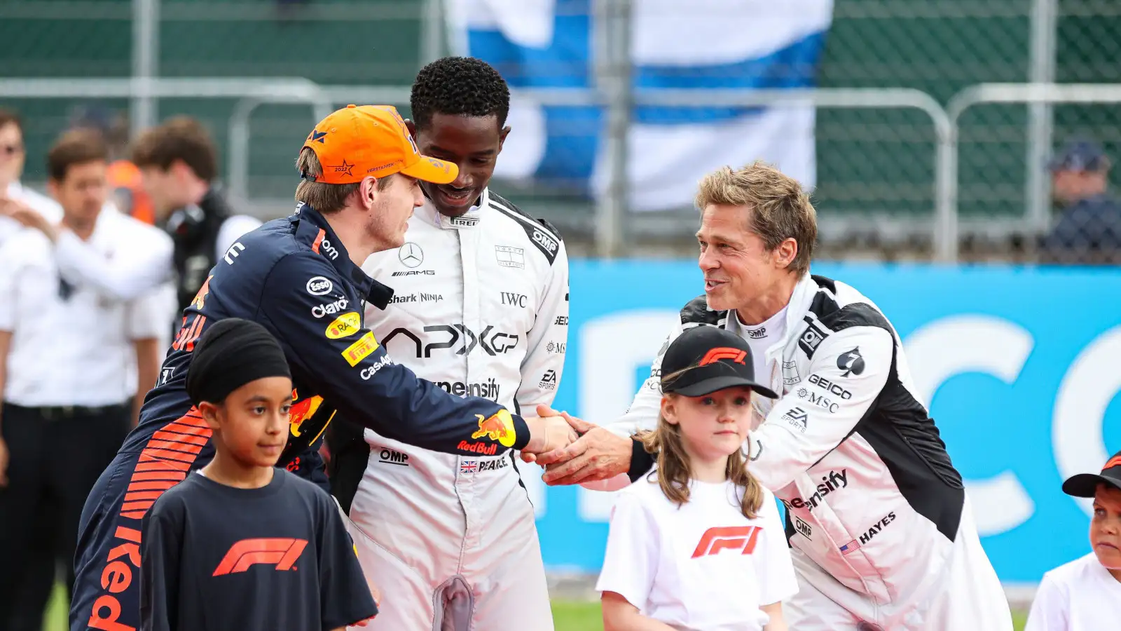 Max Verstappen shakes hands with Brad Pitt. Britain July 2023