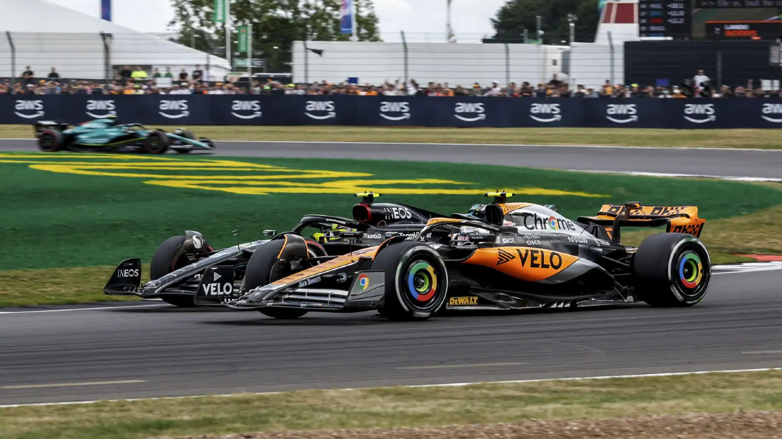 McLaren driver Lando Norris racing Mercedes driver Lewis Hamilton. Silverstone, F1 July 2023.