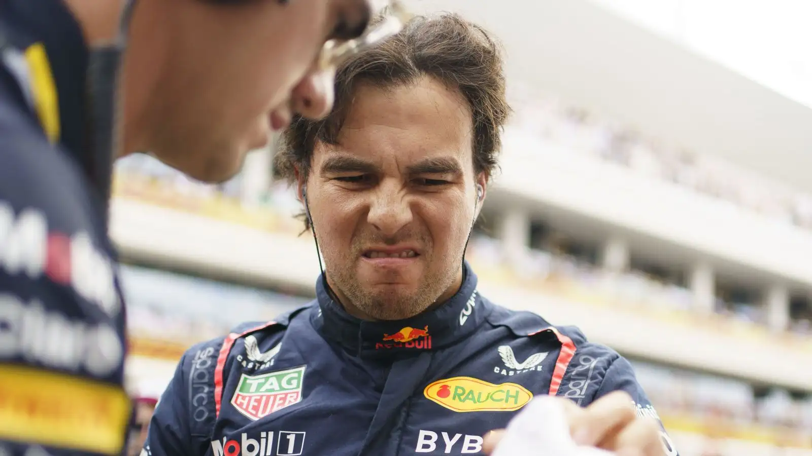 Red Bull driver Sergio Perez grimaces as he prepares for the start of the Miami Grand Prix. Miami, May 2023.