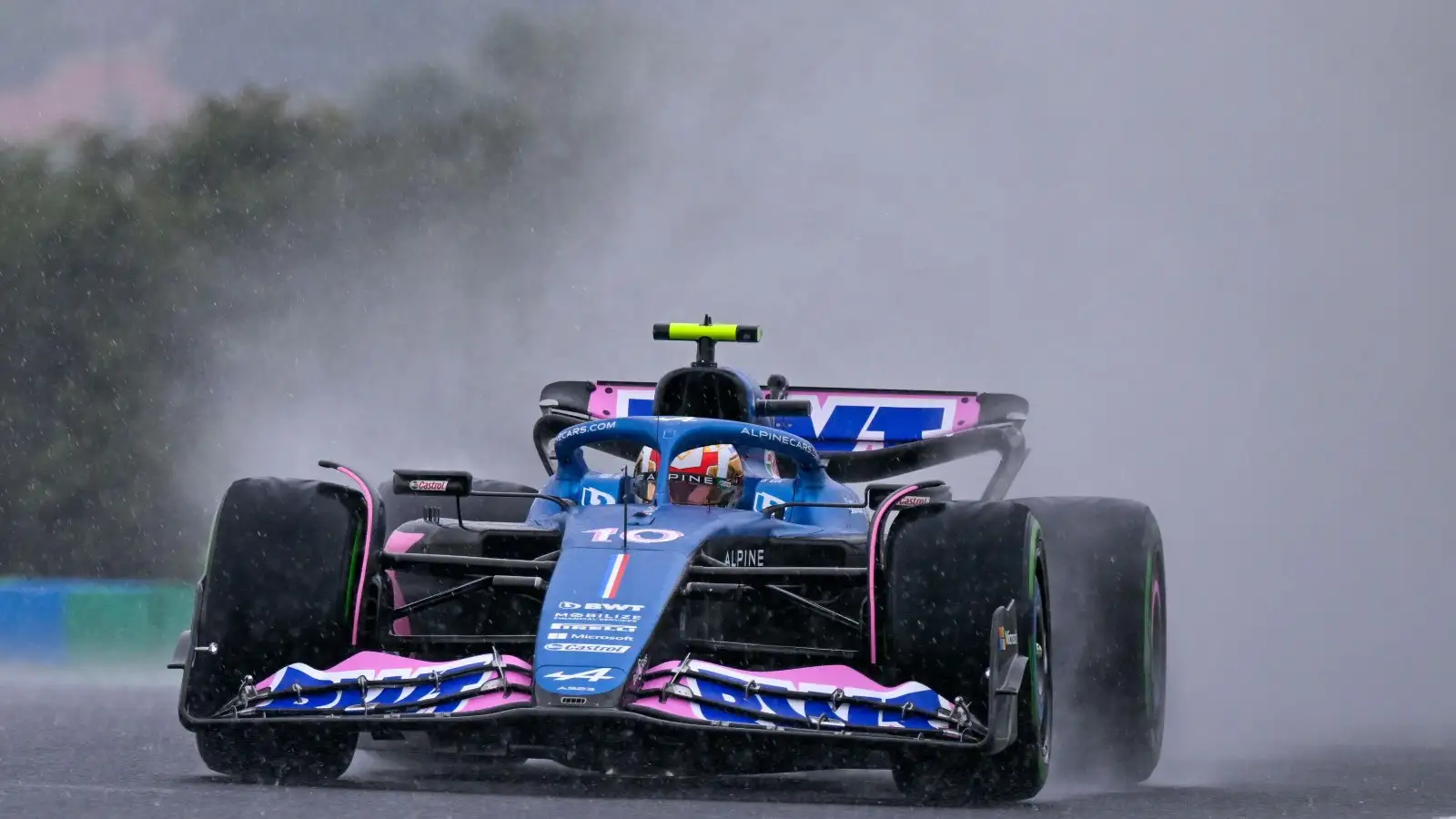 Pierre Gasly kicks up spray behind his wheels. Budapest, Hungary. July 2023.