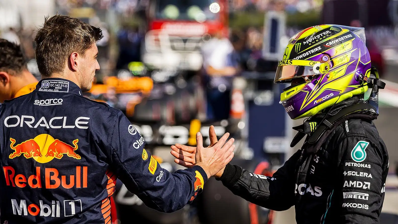 F1 rivals Lewis Hamilton and Max Verstappen shake hands at the Hungarian Grand Prix