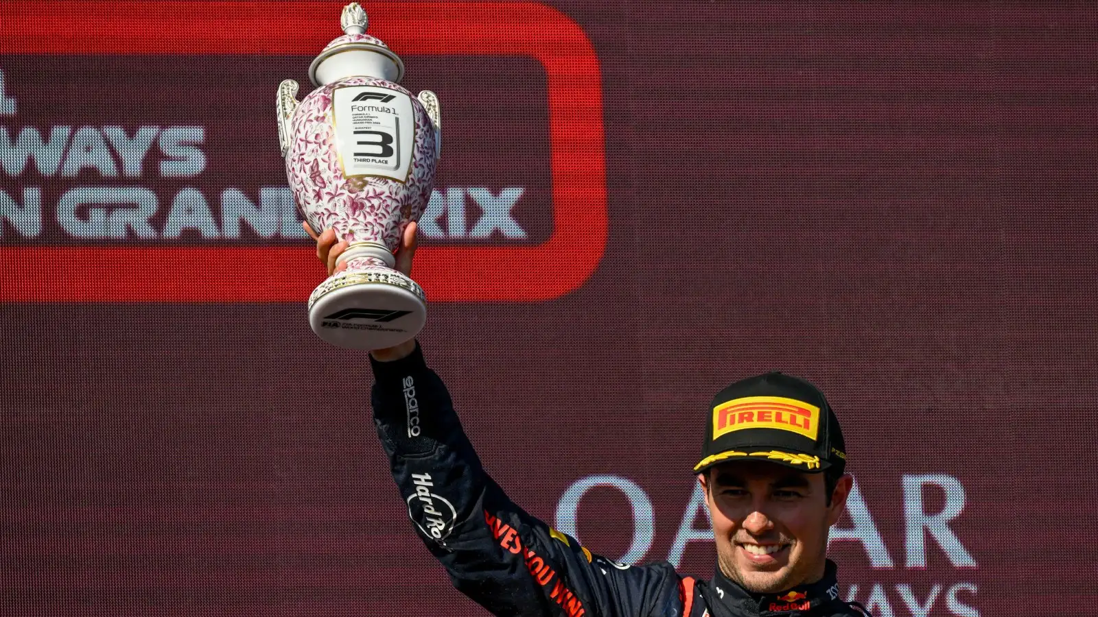 Sergio Perez lifts his P3 trophy. Hungary, July 2023.