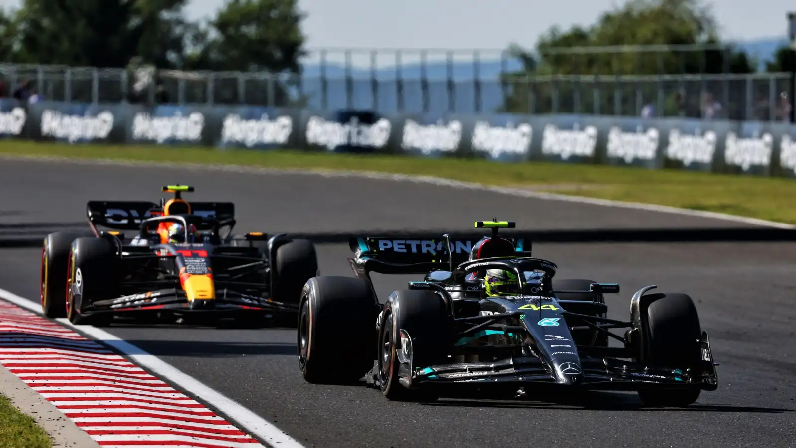 Lewis Hamilton ahead of Sergio Perez. Budapest, Hungary. July 2023.