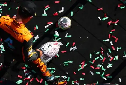 McLaren's Lando Norris looks at his broken F1 trophy at the Hungarian Grand Prix. Budapest, July 2023.