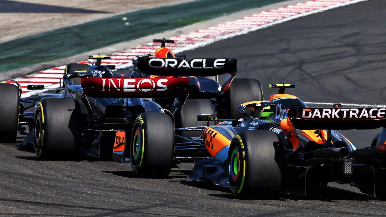 Lewis Hamilton in the middle of a Max Verstappen and Lando Norris sandwich. Hungary July 2023