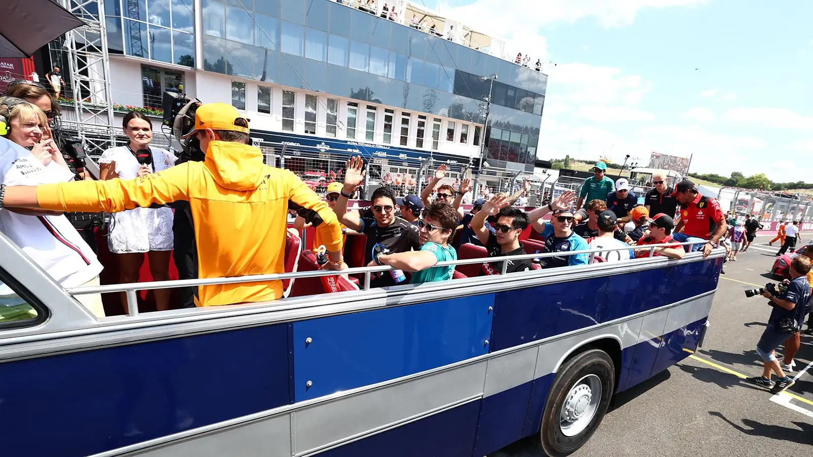 A truck takes the F1 drivers on a parade lap at the Hungarian Grand Prix.