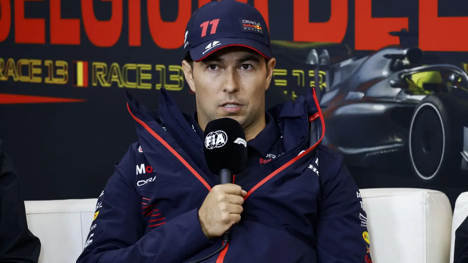 Sergio Perez speaking into a microphone. Spa, Belgium. July 2023.