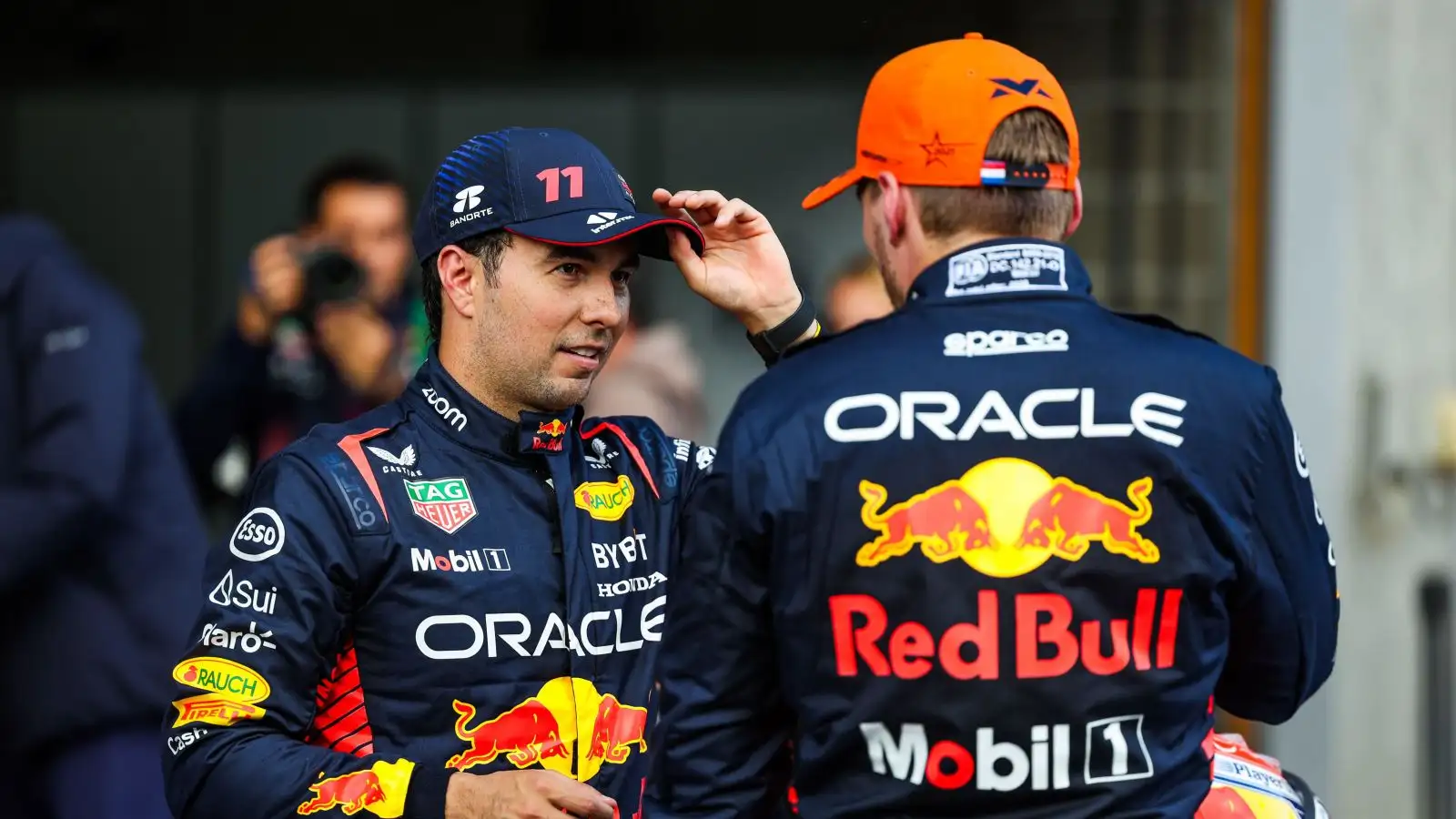 Sergio Perez in conversation with Red Bull team-mate Max Verstappen after Belgian Grand Prix qualifying. Spa, July 2023.