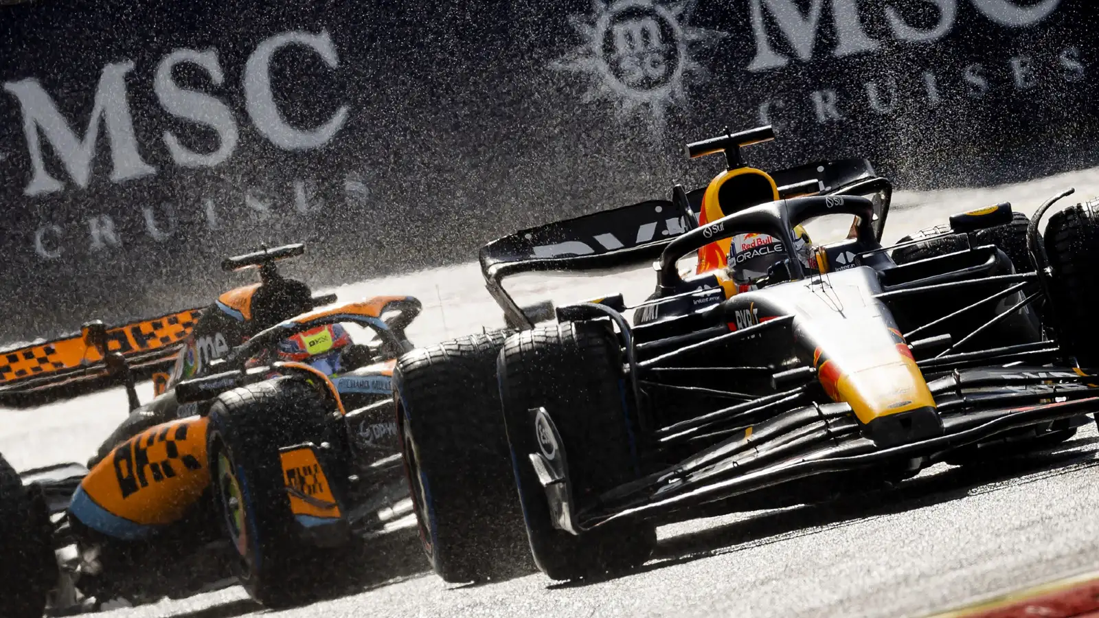 Red Bull's Max Verstappen races McLaren's Oscar Piastri at the Belgian Grand Prix. Spa-Francorchamps, July 2023.