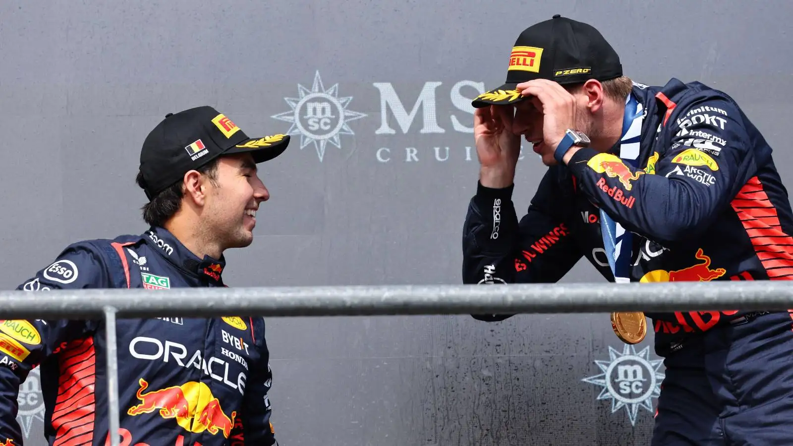Sergio Perez and Max Verstappen, Red Bull, on the podium. Belgium, July 2023.