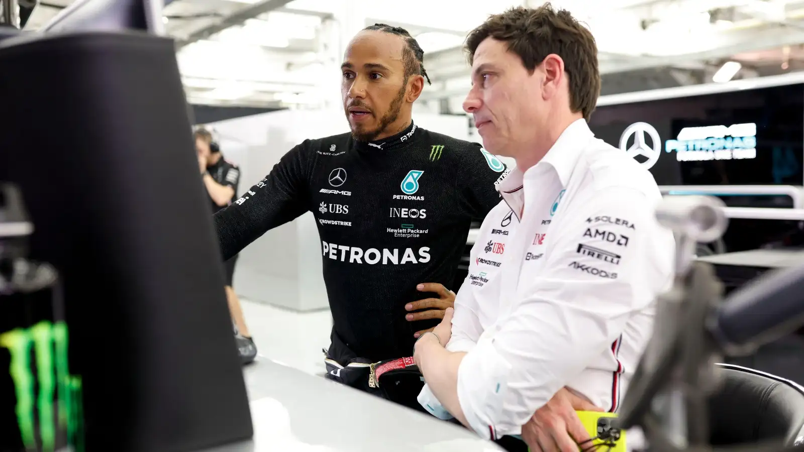 Mercedes driver Lewis Hamilton speaking with Toto Wolff.