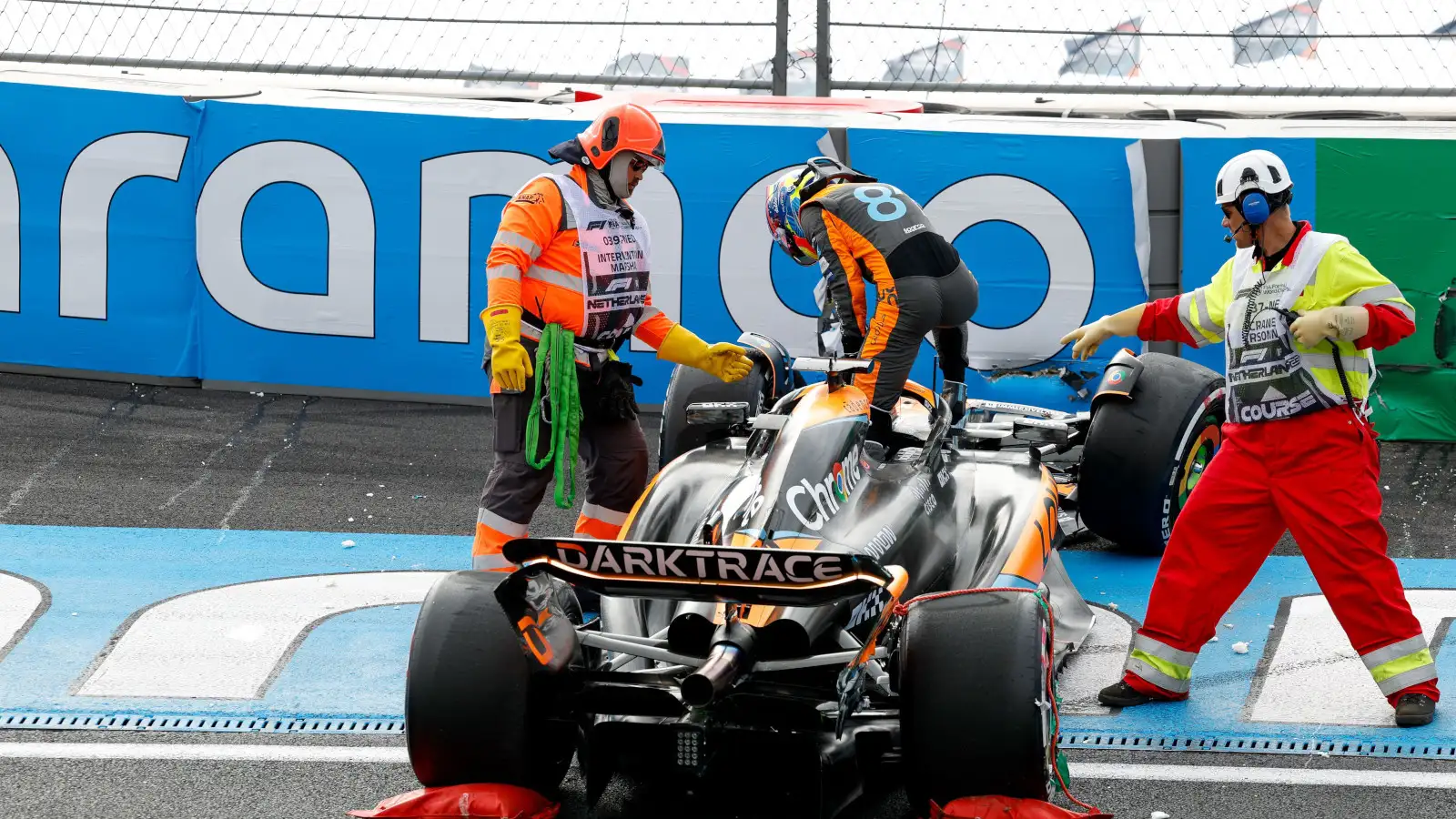 Oscar Piastri climbs from his McLaren after crashing in practice for the Dutch Grand Prix at Turn 3.
