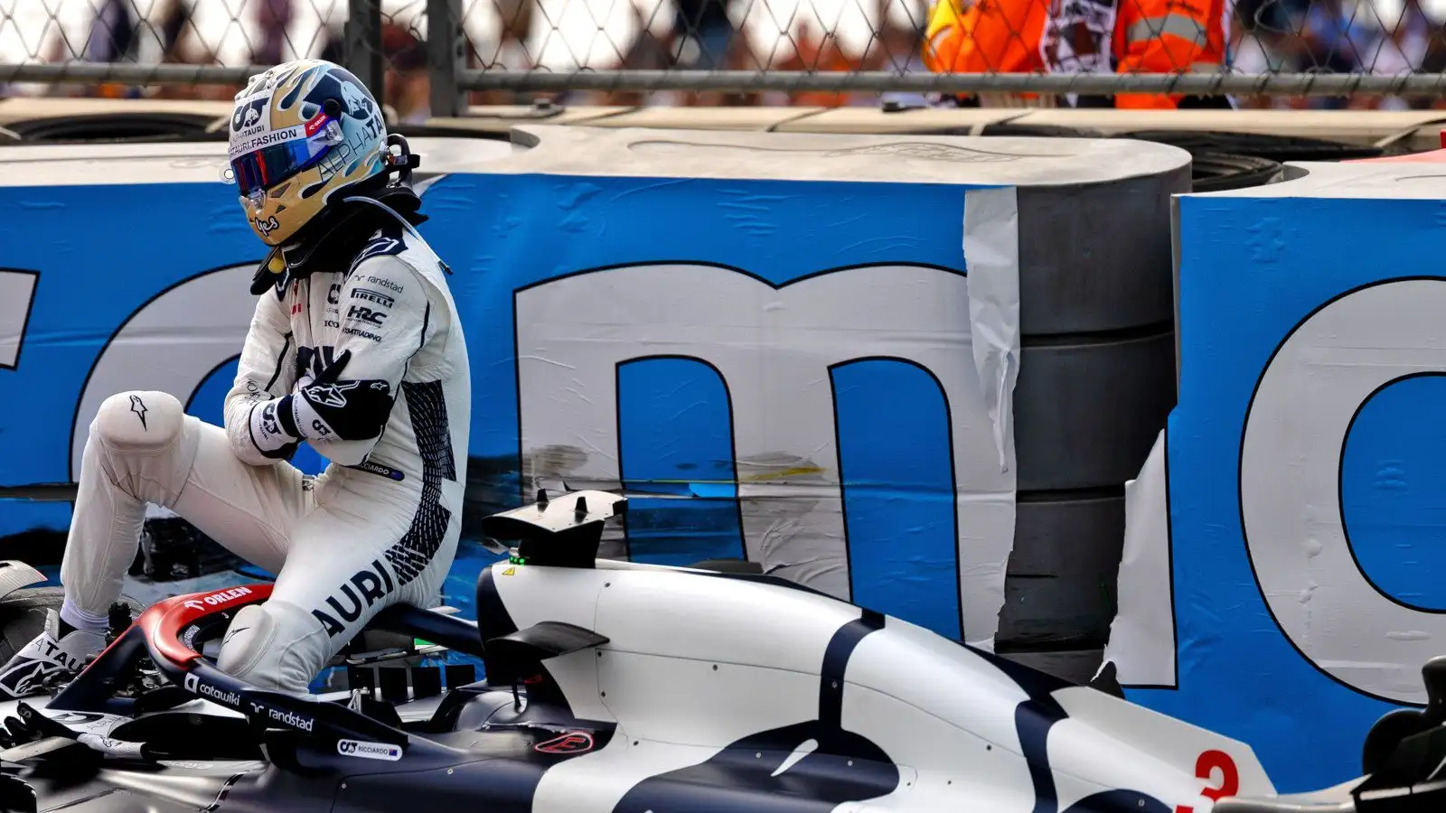 AlphaTauri driver Daniel Ricciardo cradling his hand after crashing in FP2 at Zandvoort