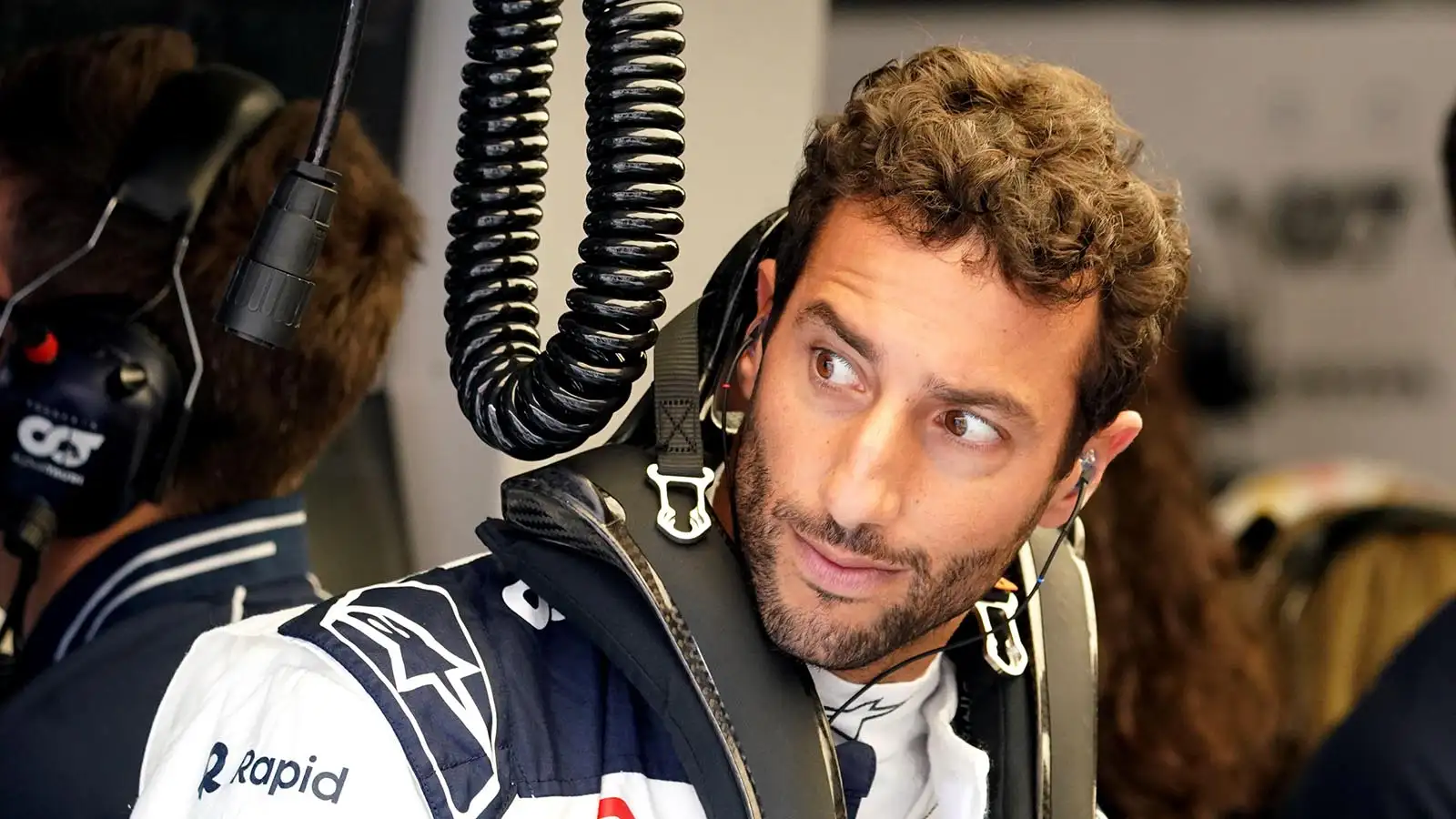 Daniel Ricciardo checks out the view from the AlphaTauri garage in Zandvoort