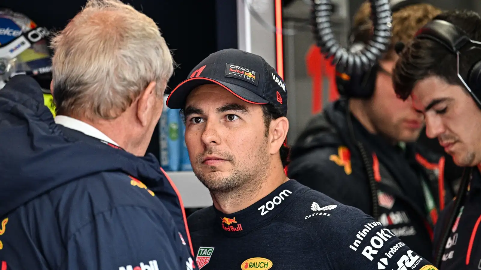 Red Bull's Helmut Marko speaking with Sergio Perez