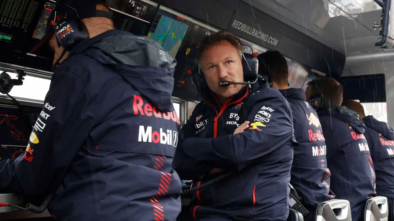 Christian Horner looks out from the Red Bull pit wall.