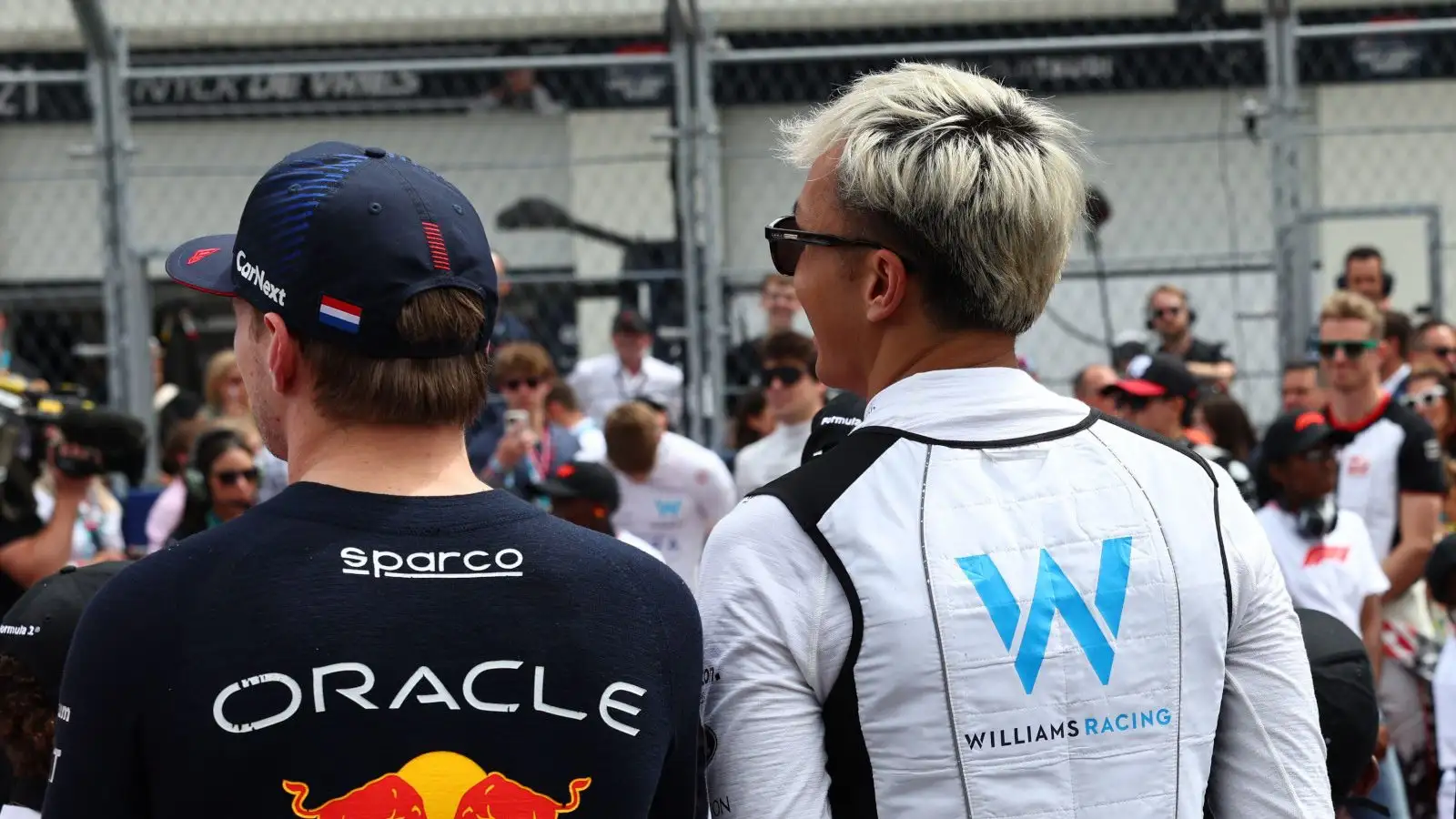 Red Bull driver Max Verstappen and Alex Albon standing for the national anthem in Miami.