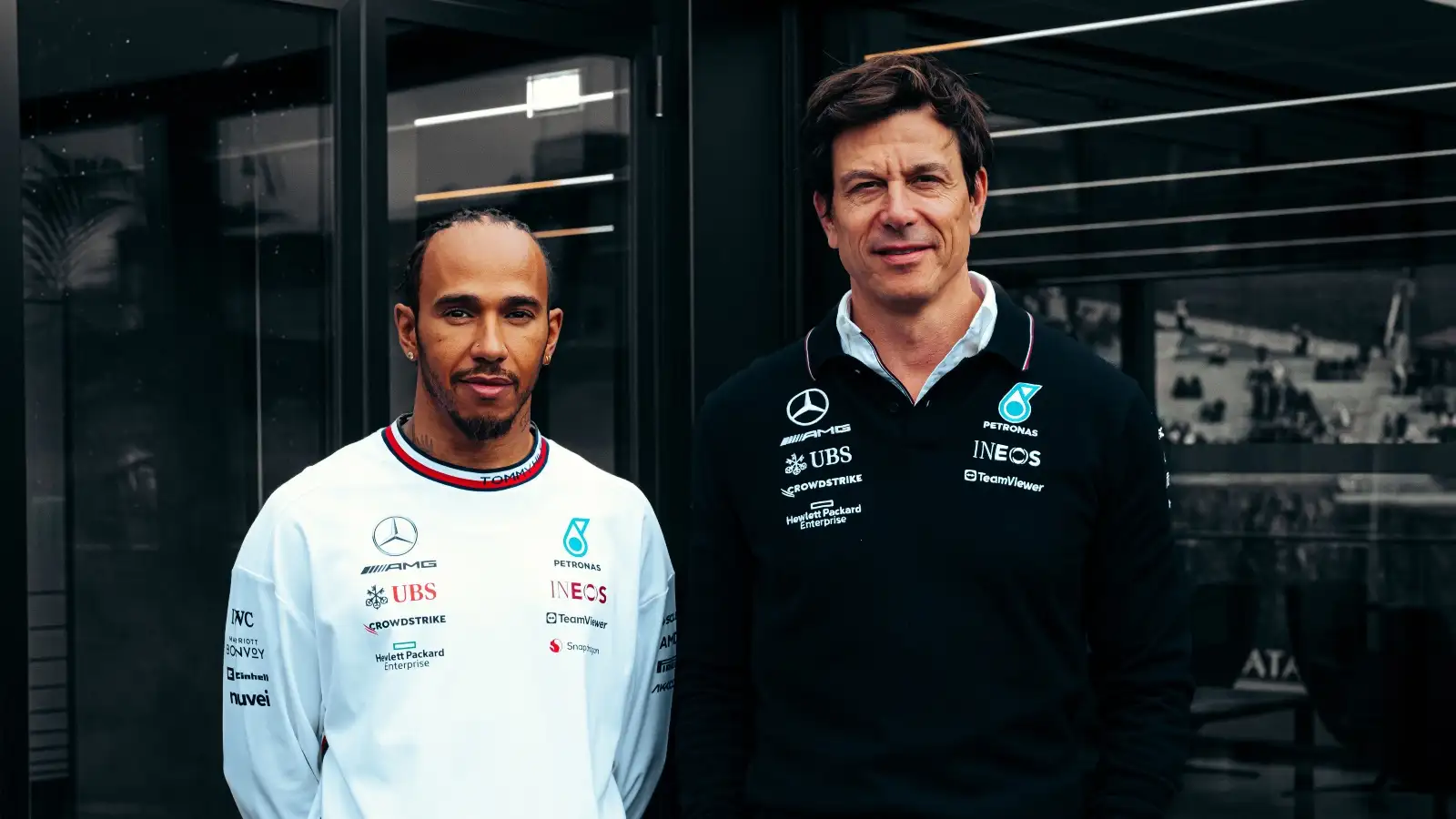 Lewis Hamilton and Toto Wolff pose for a photograph after new contract extension