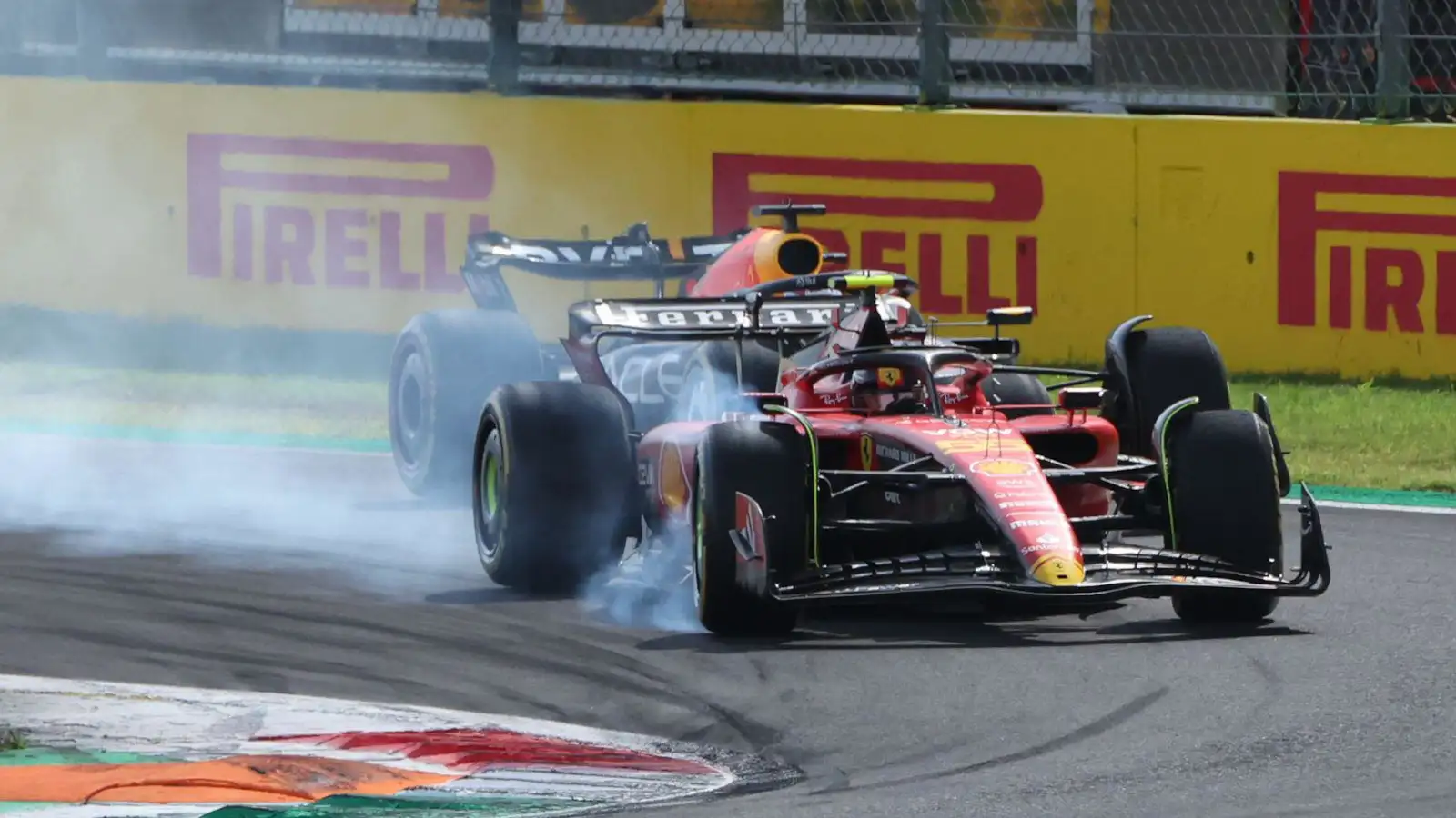 Ferrari driver Carlos Sainz and the Red Bull of Max Verstappen fighting for position at the Italian Grand Prix.
