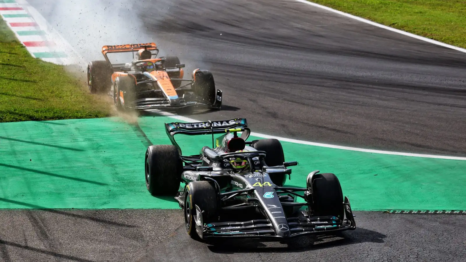 Mercedes Lewis Hamilton off the track at the Roggia chicane after clipping the McLaren of Oscar Piastri.