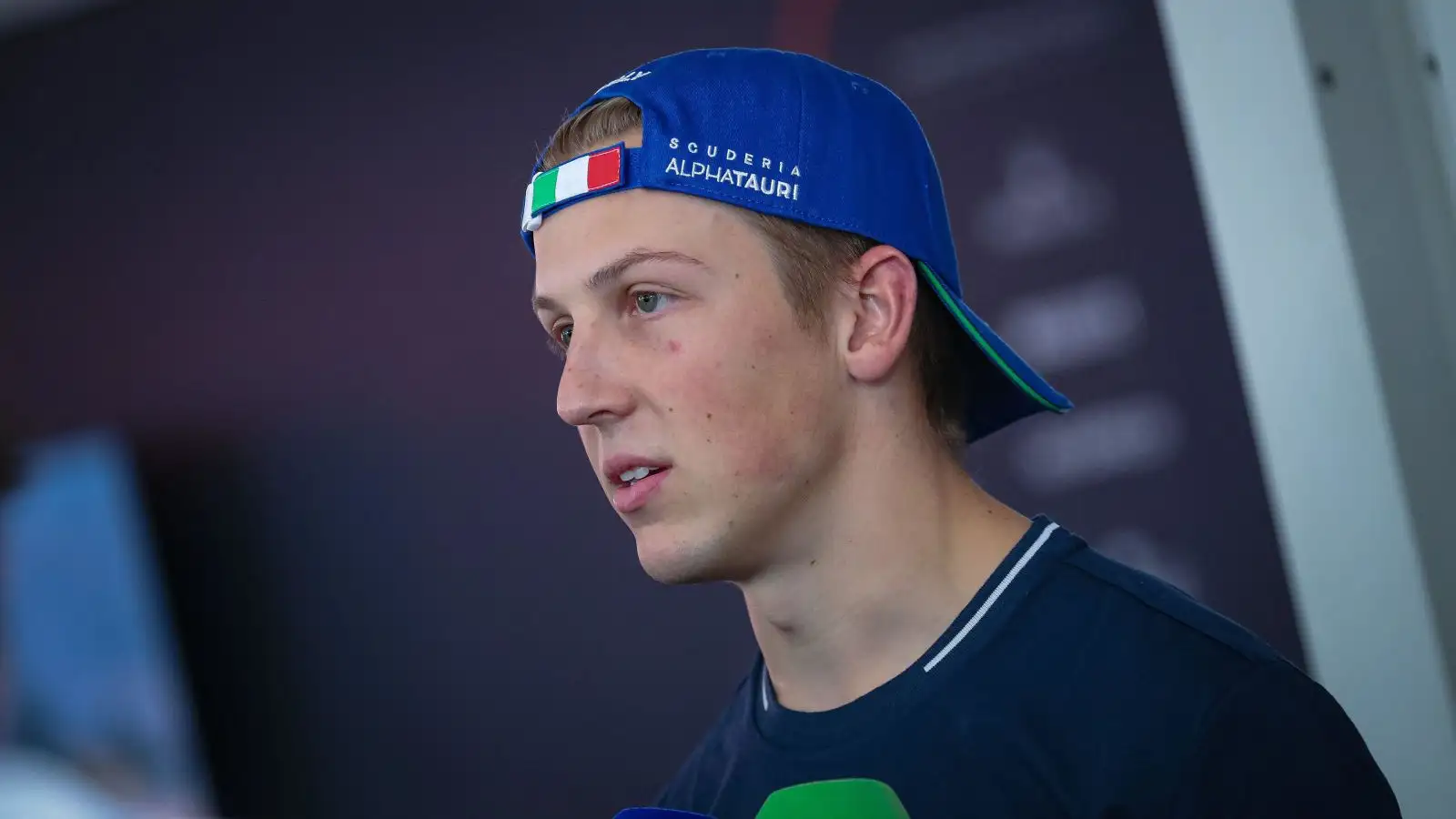 AlphaTauri driver Liam Lawson addresses the media at the 2023 Italian Grand Prix at Monza.