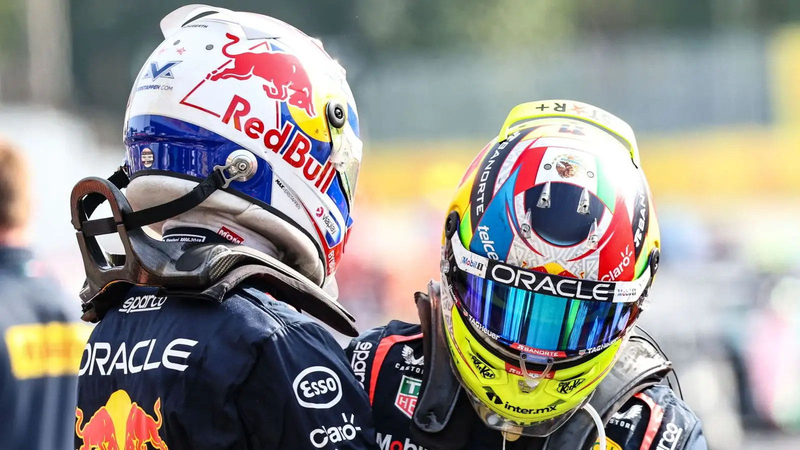 Max Verstappen and Sergio Perez embrace after securing a Red Bull one-two finish at the Italian Grand Prix at Monza.