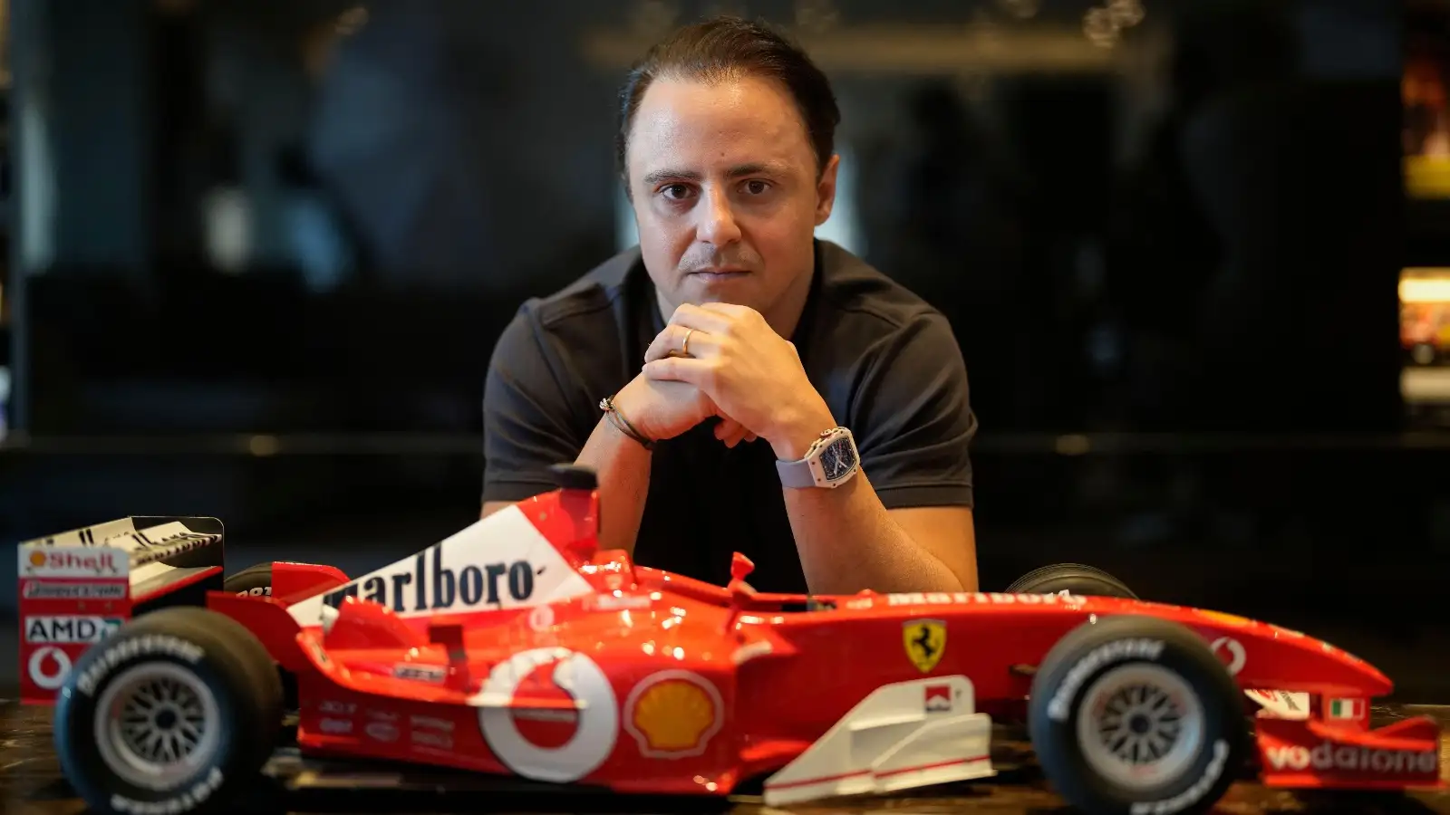 Felipe Massa with a model Ferrari.