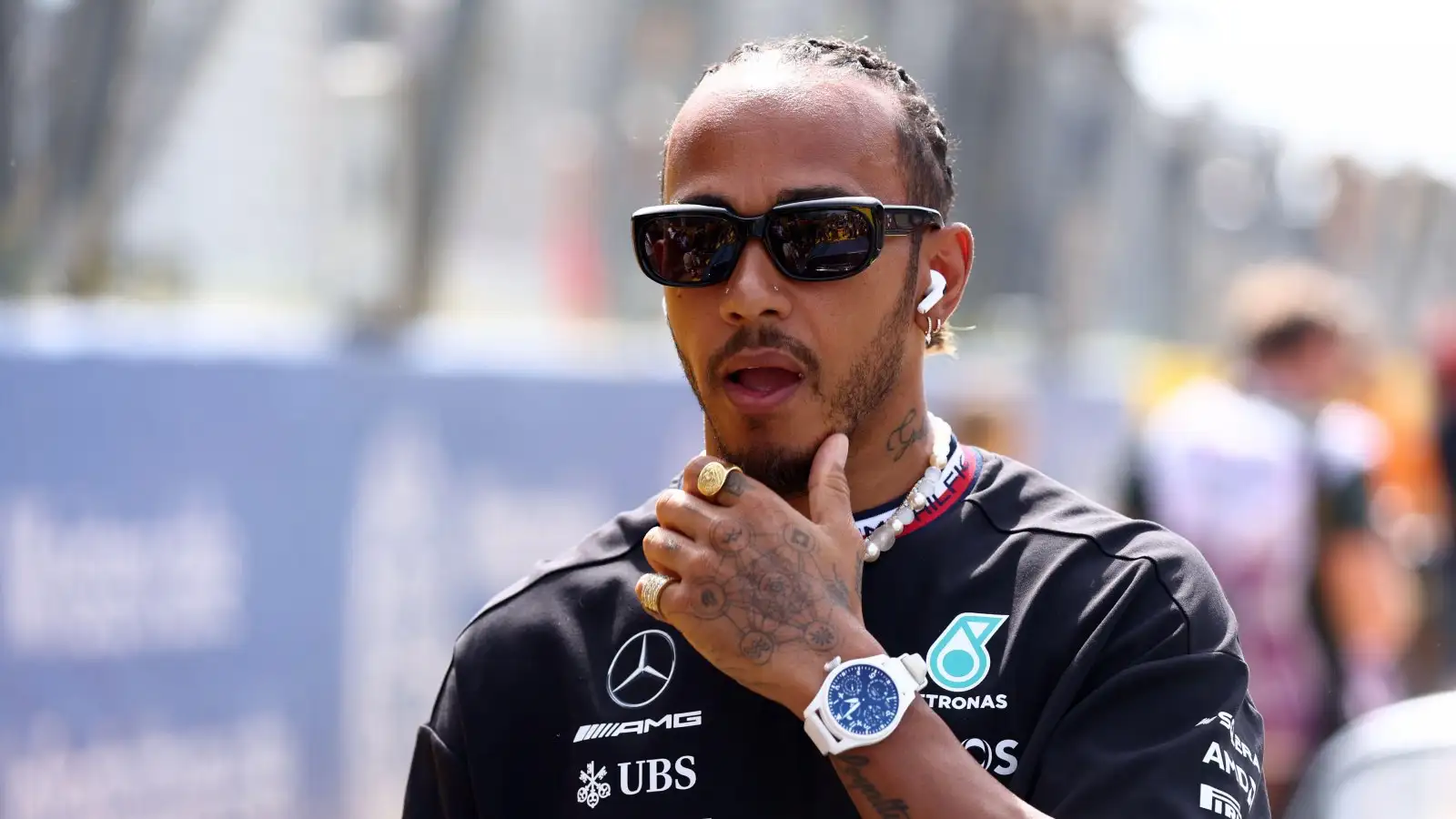 Lewis Hamilton makes his way through the paddock area at the Italian Grand Prix.