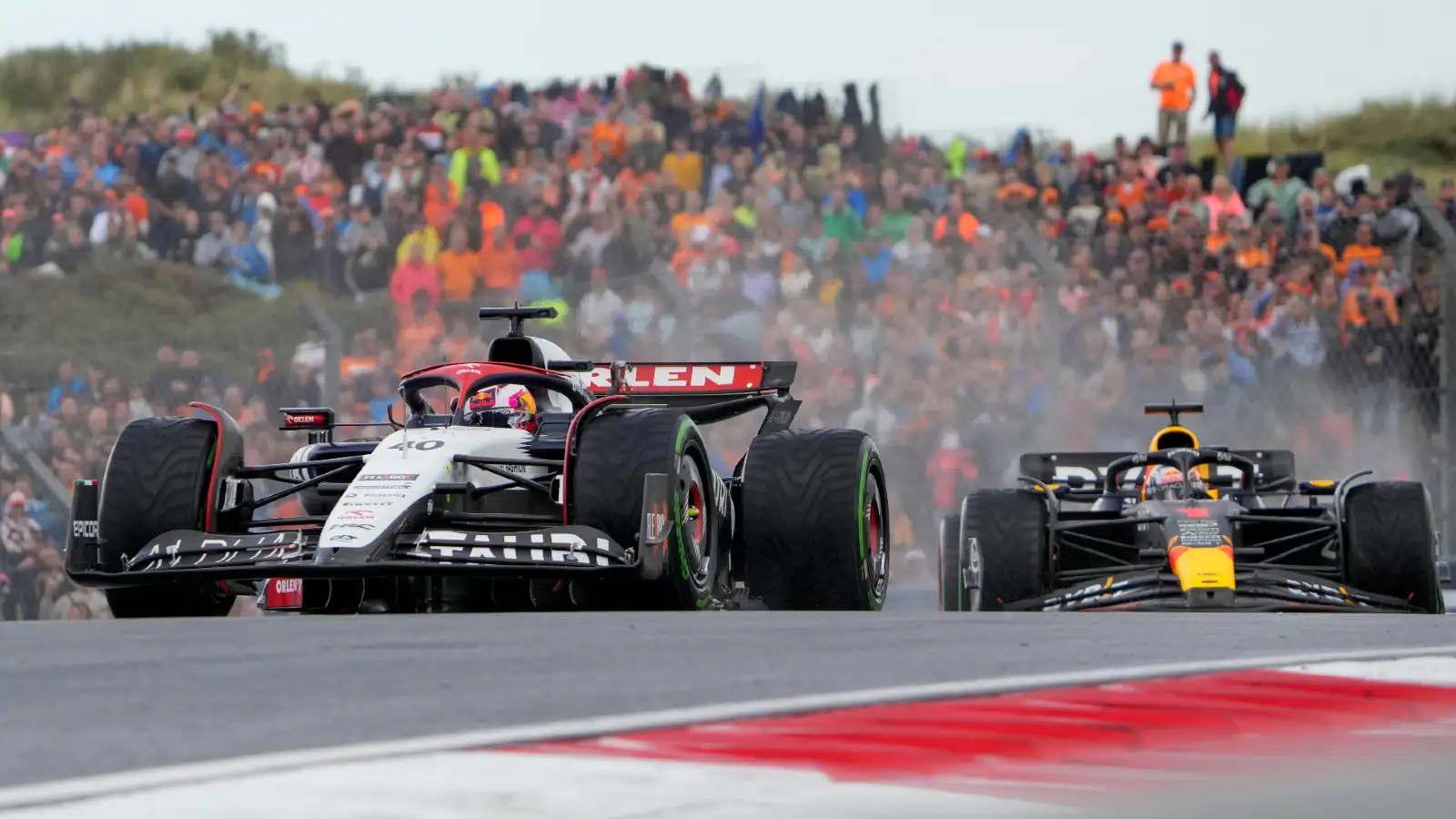 Zandvoort: Liam Lawson and Sergio Perez together on track at the Dutch Grand Prix.