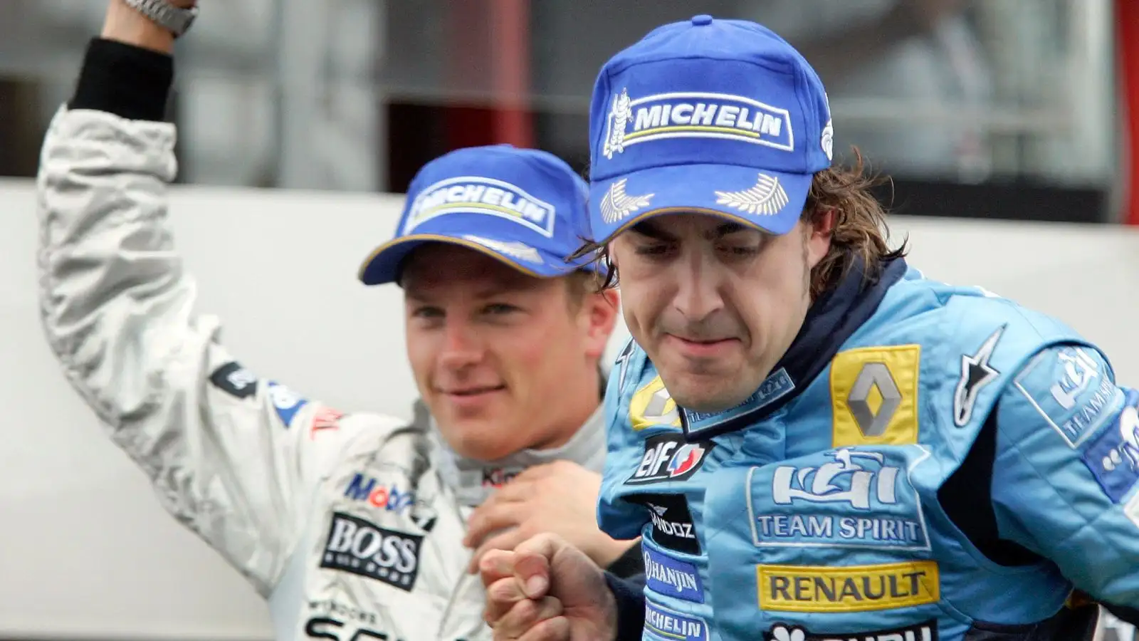 Kimi Raikkonen (McLaren) and Fernando Alonso (Renault) celebrate on the podium at the 2005 Belgian Grand Prix at Spa.
