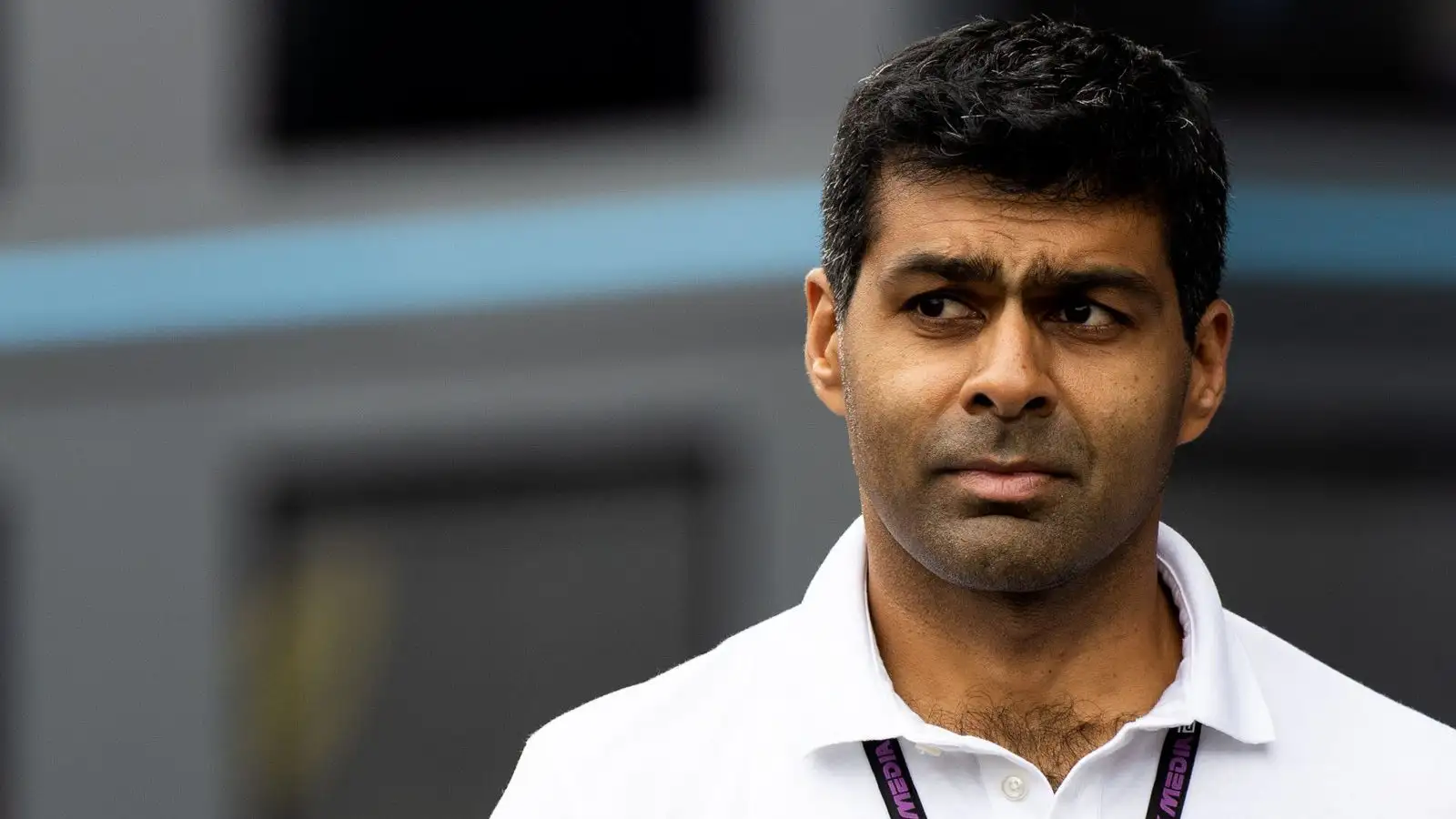 Karun Chandhok walking through the paddock.