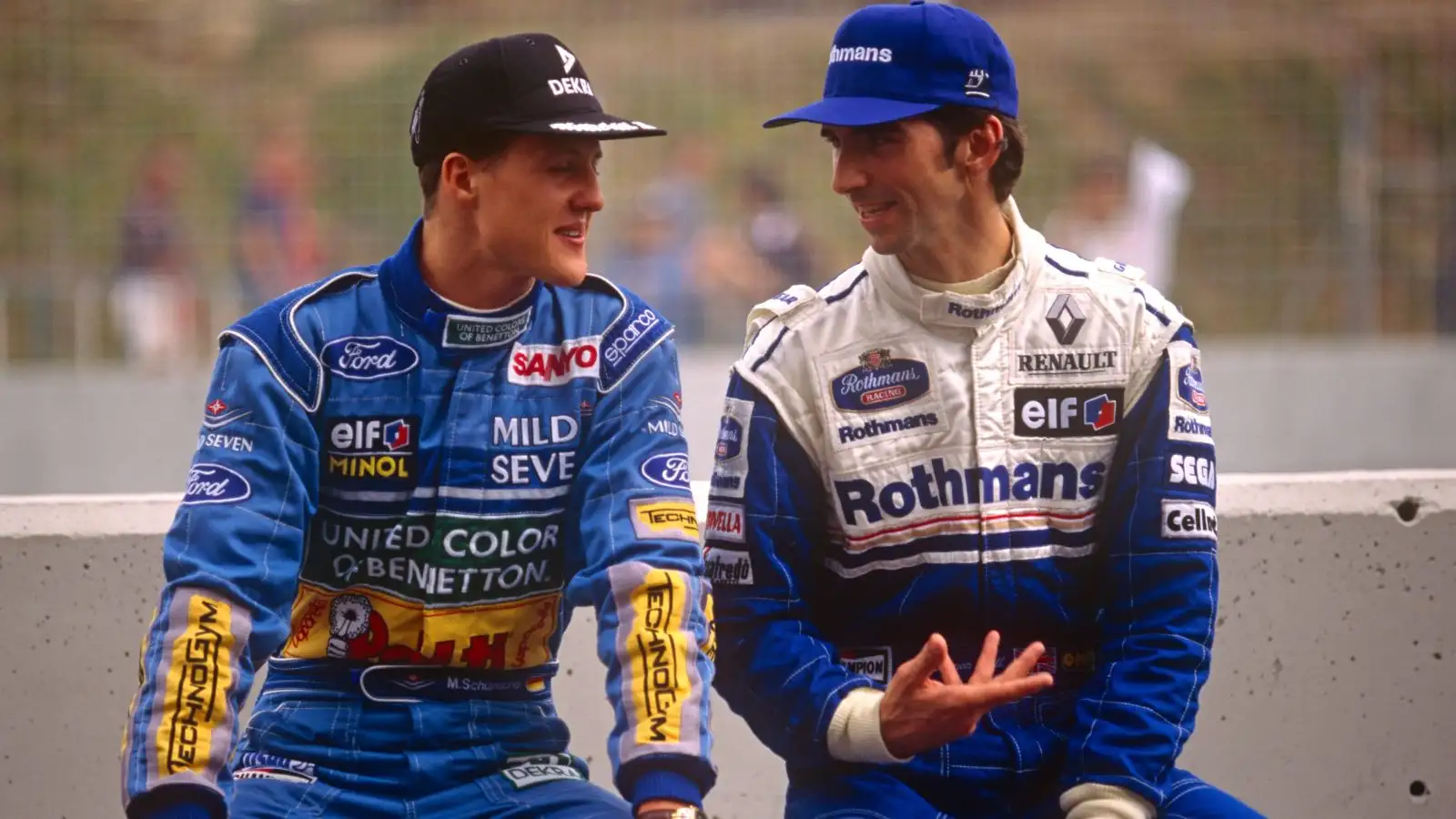 Bitter title rivals Michael Schumacher (Benetton) and Damon Hill (Williams) in conversation during the F1 1994 season.