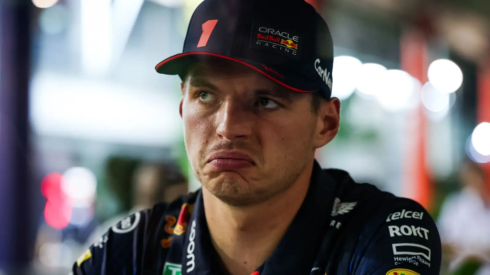 Red Bull driver Max Verstappen pulls an unimpressed face as he is interviewed.