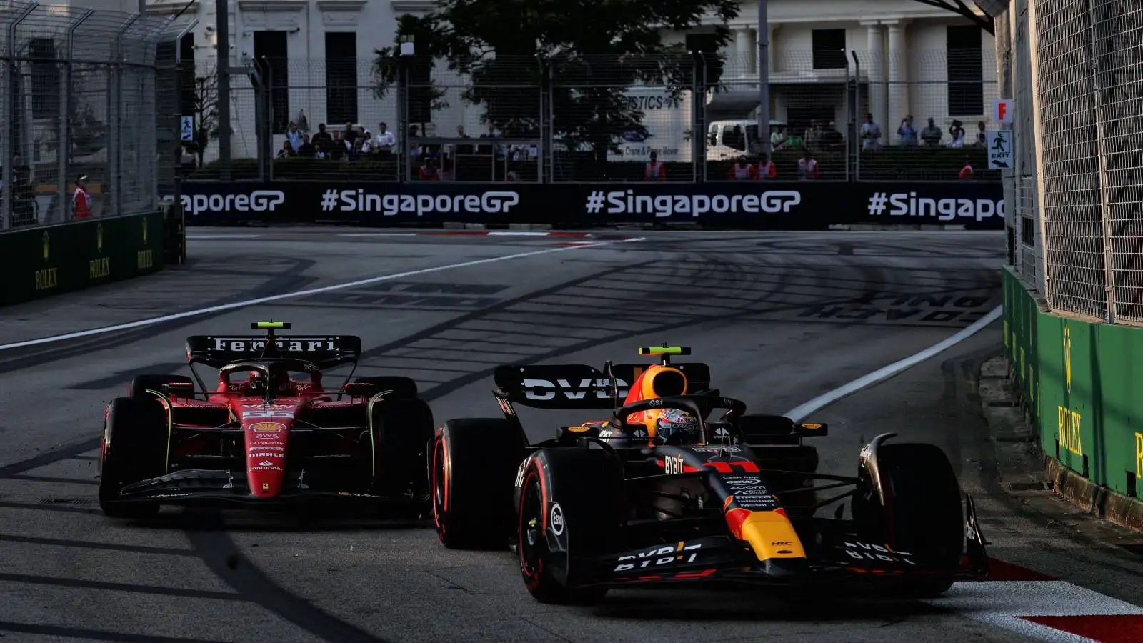 Carlos Sainz, Ferrari, close to Sergio Perez, Red Bull. Singapore, September 2023.