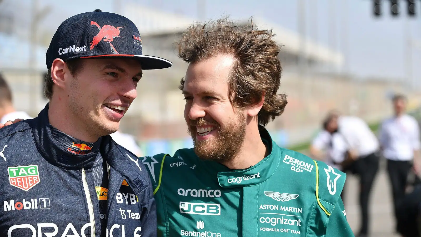 Sebastian Vettel with his arm around Max Verstappen in the pre 2022 group grid event.